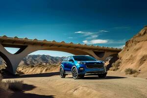 a blue kia sportage is parked under a bridge in t photo