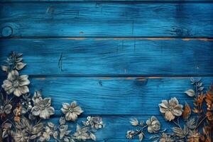 a blue wooden background with flowers on it photo