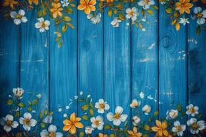 a blue wooden background with flowers on it photo