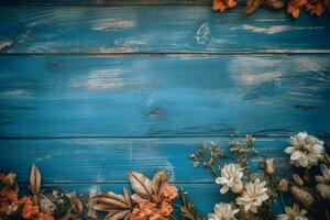 a blue wooden board with flowers on it photo