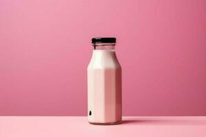 a bottle of milk with a black cap sits on a table photo