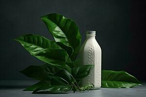 a bottle of milk with a green leaf next to it photo