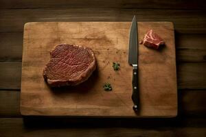 a cutting board with a knife and fork next to a p photo