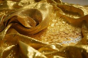 a gold cloth with gold glitter on it photo