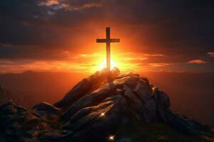 cross on a mountain with the sun setting behind i photo