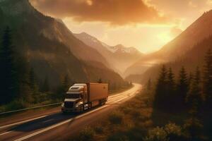 truck driving through mountain pass at sunset photo