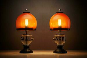 two orange and black lamps with the word photo