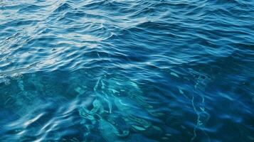 a blue water with ripples in the water photo