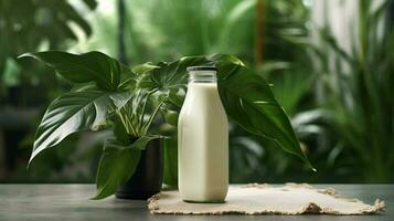 a bottle of milk with a black cap sits on a table photo