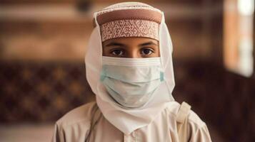 a muslim boy wearing protective mask covid 19 mas photo