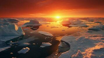 the sun sets over the ice floes in the arctic ocean photo