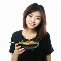 Asian young woman is eating diet food photo