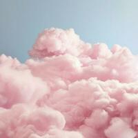 A cotton candy pink background with fluffy clouds photo