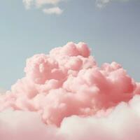 A cotton candy red background with fluffy clouds photo