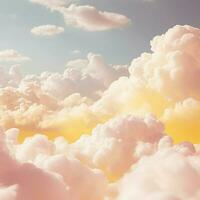 A cotton candy yellow background with fluffy clouds photo