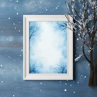 Snowy trees with a blue watercolor background and a frame photo