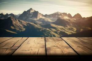 Wooden table background against mountain range in the clouds, with copy space photo