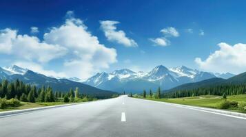 Asphalt road in the mountains with blue sky and white clouds. photo