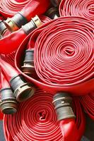 a close up of a red fire hose photo