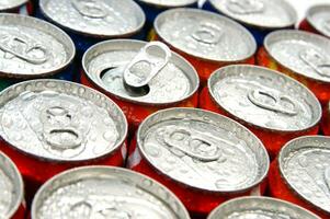 a close up of cans of soda photo
