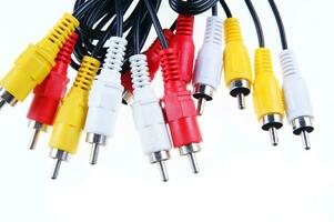 several different colored cables with different colored plugs photo