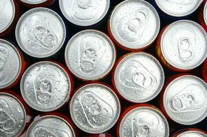 a close up of cans of soda photo