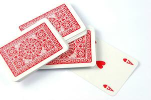 a pile of playing cards on a table photo