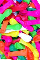 a pile of colorful plastic balloons photo