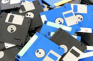 a pile of floppy disks photo