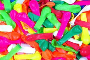 a pile of colorful plastic balloons photo