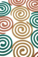 a group of colorful coasters with a spiral design photo