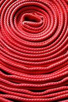 a close up of a red fire hose photo