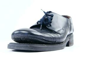 broken old black shoes photo