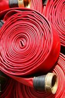 a close up of a red fire hose photo