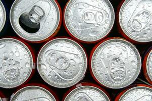 a close up of cans of soda photo