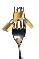 a fork, knife and spoon are arranged in a holder photo