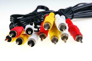 several different colored cables with different colored plugs photo