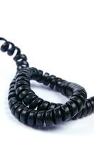 a black cord with a white background photo
