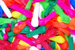 a pile of colorful plastic balloons photo