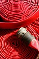 a close up of a red fire hose photo