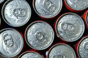 a close up of cans of soda photo