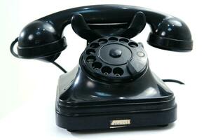 a black telephone on a white background photo