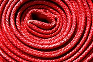 a close up of a red fire hose photo