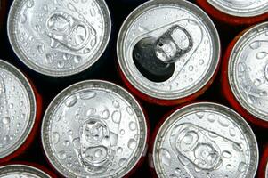 a close up of cans of soda photo