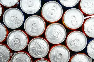 a close up of cans of soda photo