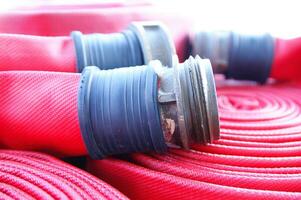 a close up of a red fire hose photo