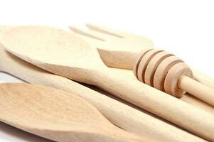 a group of wooden spoons sitting on a white surface photo