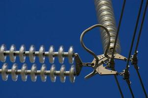 a close up of a power line with wires attached photo
