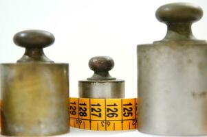 old weights for scales and tape measure to control the diet photo