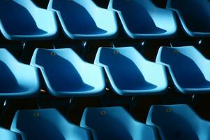 a row of blue chairs photo